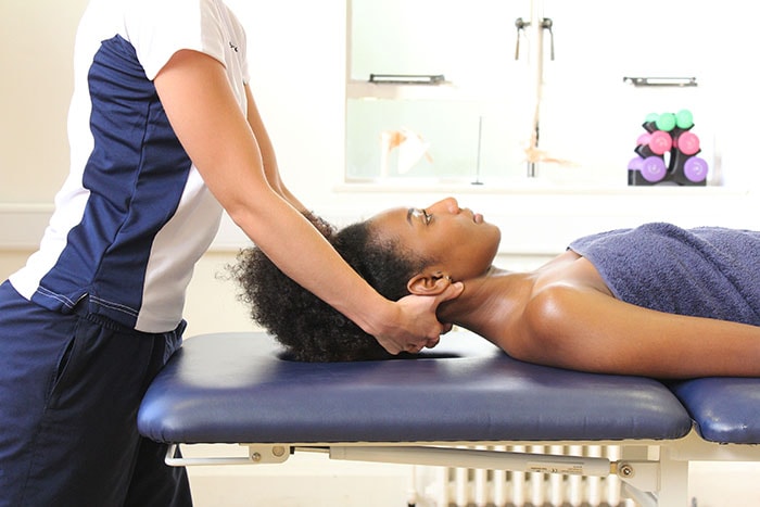 Upper neck massage to decrease tension in Manchester clinic