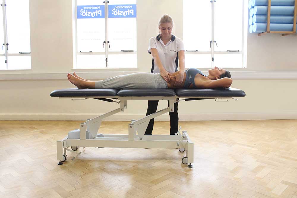 Soft tissue massage of abdominal oblique muscle
