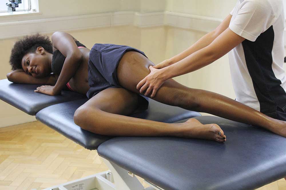 Post workout massage focused on vastus lateralis and illio-tibial band