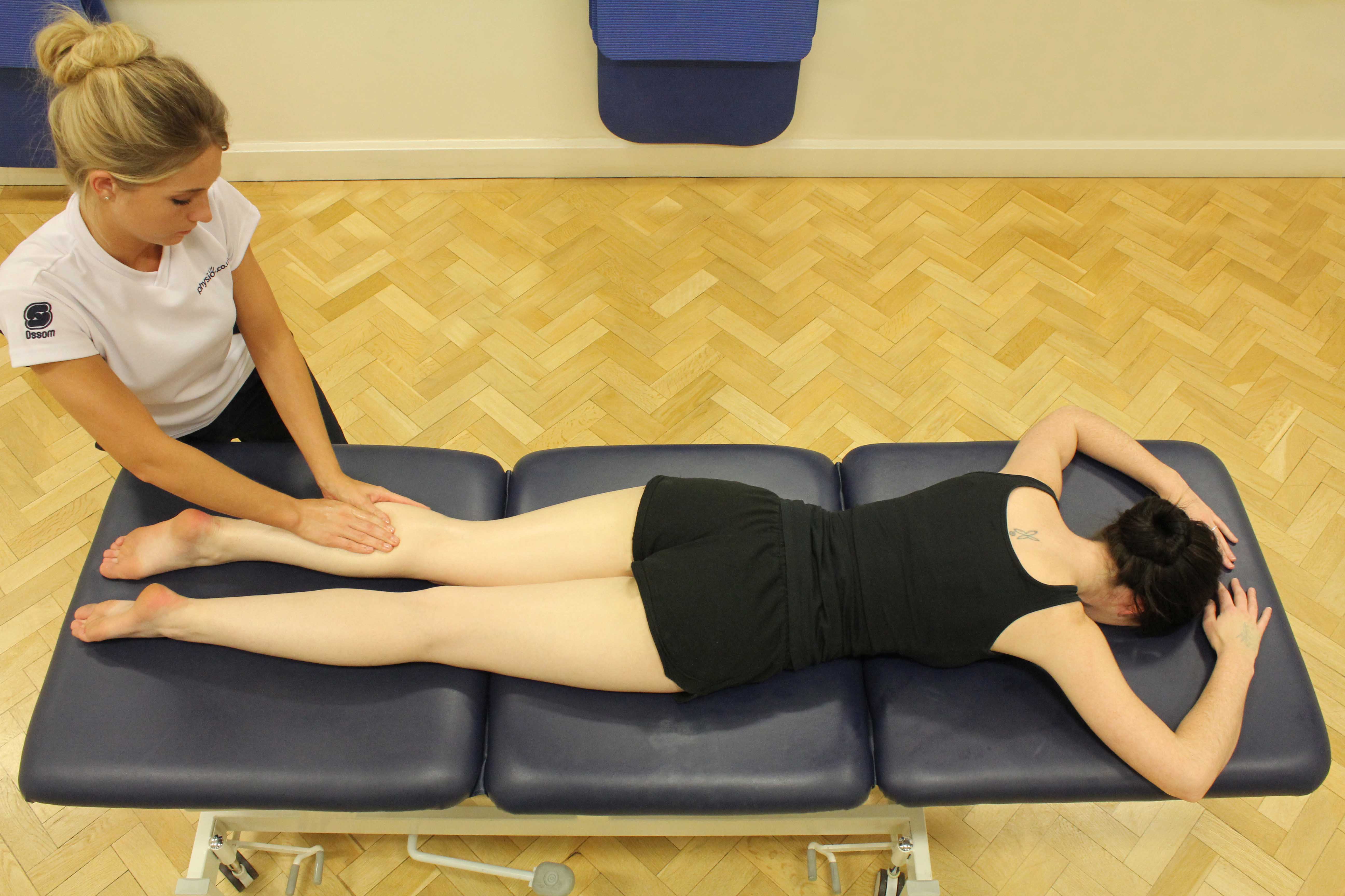 Soft tissue massage of the gastrocnemius muscle by an experienced therapist